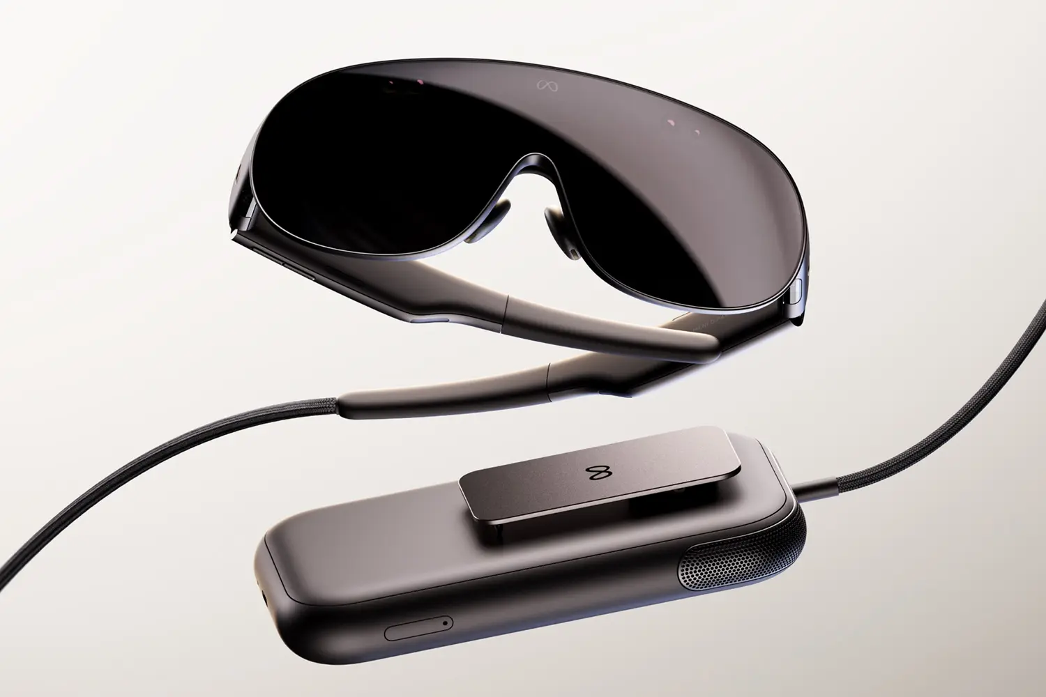 Meta VR Glasses with the 300g compute puck on a braided cable: the clip-on puck holds the chip, battery, and storage so the visor weighs about 100g